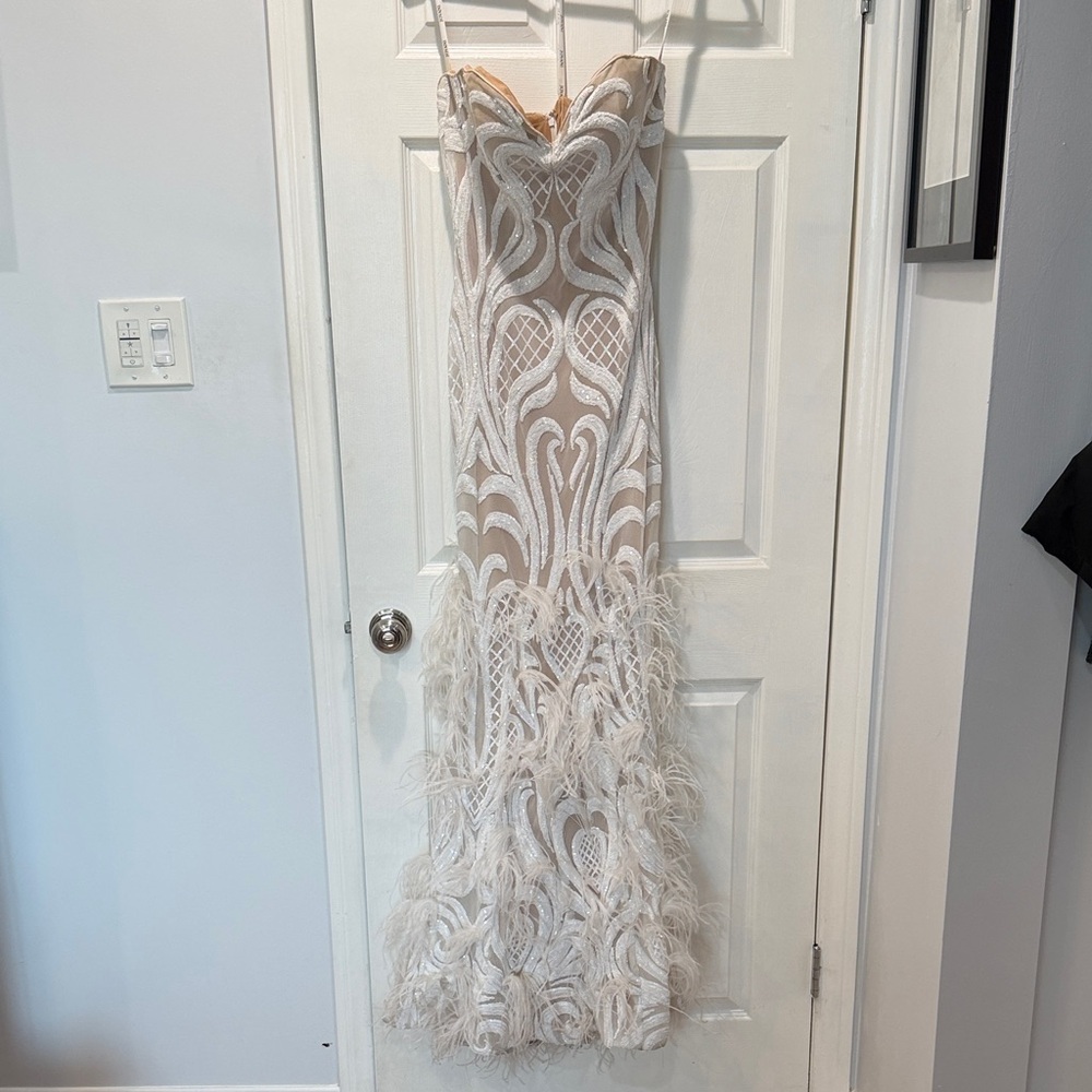 Elegant White Strapless Gown with Feather Details